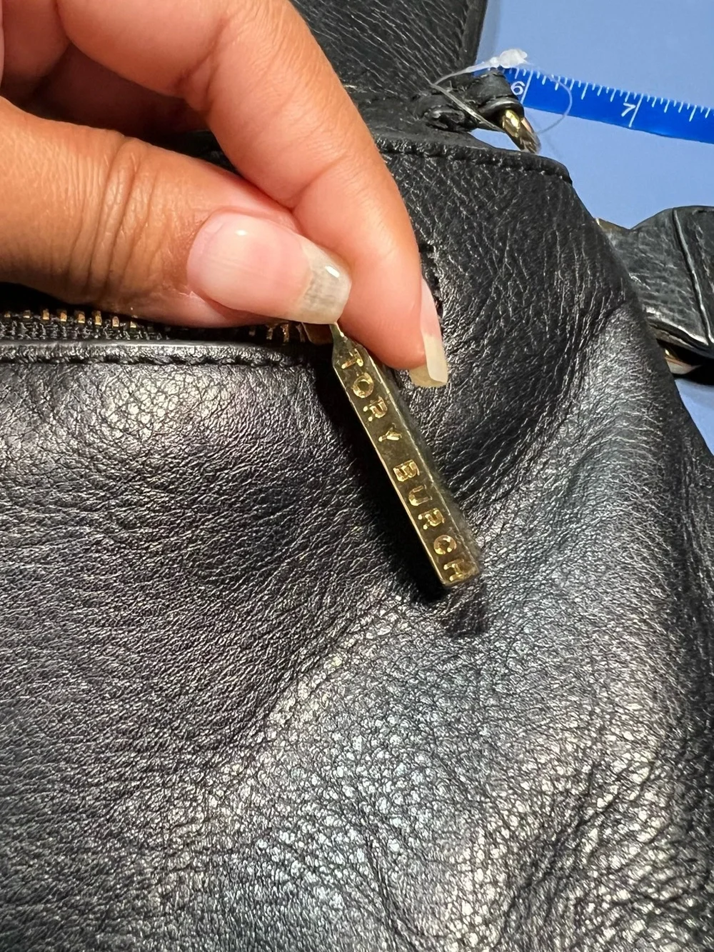 Pre-loved Tory Burch Black Leather clutch with Gold hardware